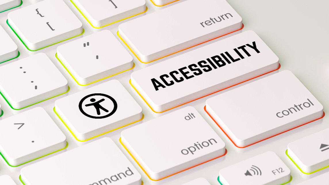 White keyboard with colorful accents featuring large ACCESSIBILITY key with universal access icon.