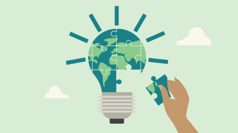 Hand placing puzzle piece into lightbulb-shaped globe, symbolizing global accessibility solutions.