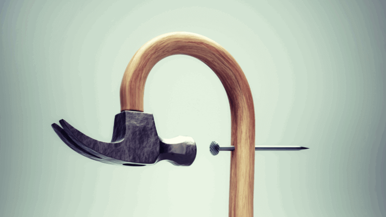 A hammer and nail bent into a U-shape, symbolizing the wrong tool for the job.