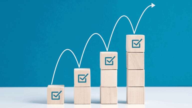 Ascending stacked blocks with checkmarks showing progressive improvement.